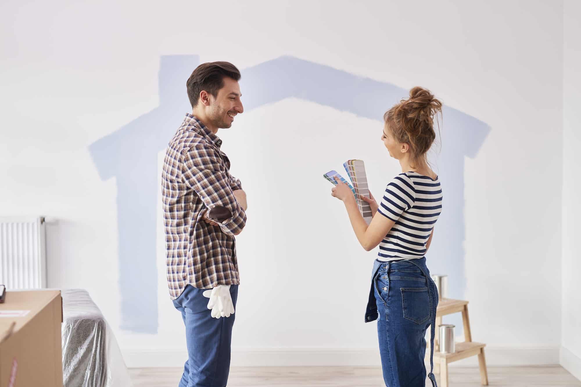 Couple choosing paint colors for home renovation